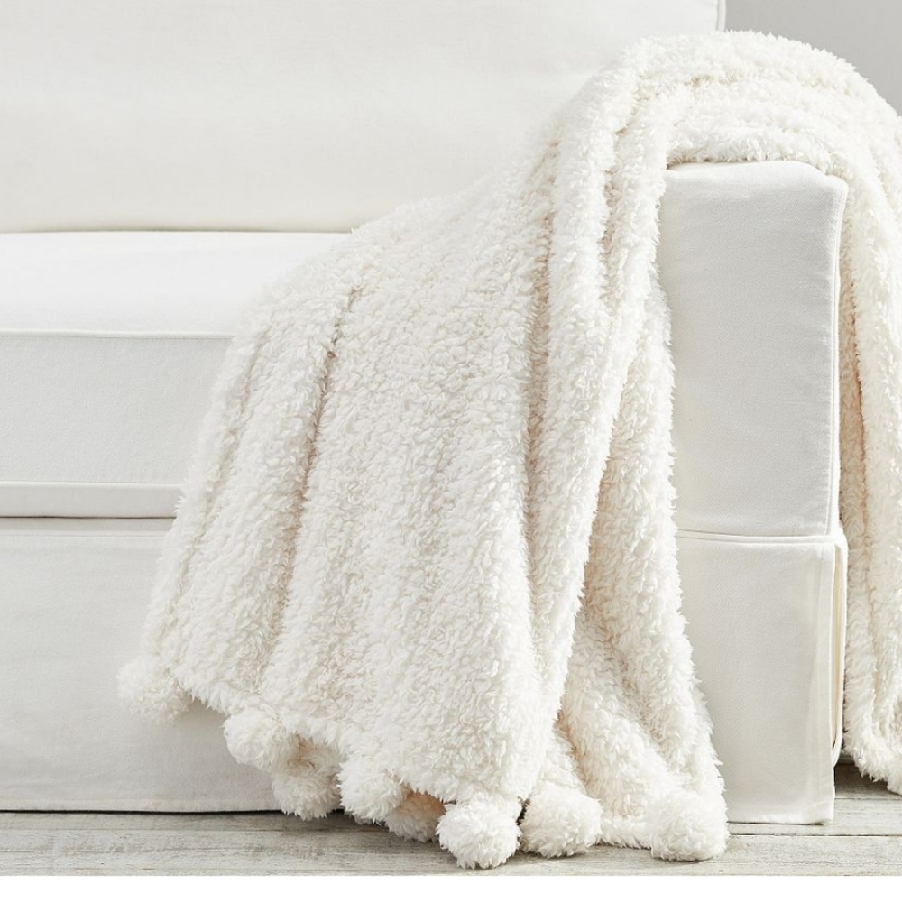 - Cozy pom pom sheria throw blanket- pottery barn